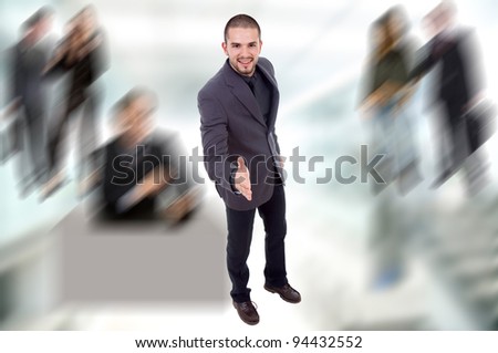 young business man full body offering his hand