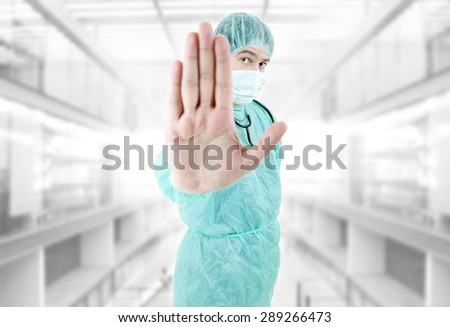 young male doctor going stop with his hand at the hospital