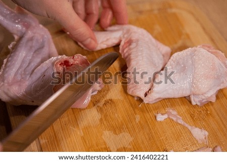 Similar – Image, Stock Photo Hand mit frischen halbierten Orangen auf einem Holzschneidebrett auf einem schwarzen Hintergrund