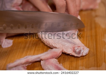 Similar – Image, Stock Photo Hand mit frischen halbierten Orangen auf einem Holzschneidebrett auf einem schwarzen Hintergrund