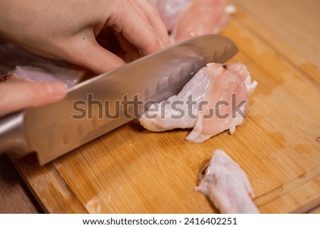 Similar – Image, Stock Photo Hand mit frischen halbierten Orangen auf einem Holzschneidebrett auf einem schwarzen Hintergrund