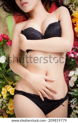 beautiful sexy body of woman in lingerie with flowers