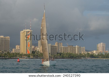 Honolulu, Dec.  26:  Racing sailboat crews heading towards Diamond Head Buoy on the Waikiki Friday Night Sailboat Race.  Honolulu, Hawaii, USA.  Dec. 26, 2014.