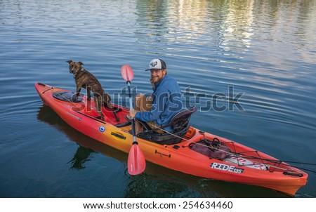 Honolulu, Feb. 18:  Kayak fishing in Honolulu Lagoon by a man and his dog as the fishing season opens today. Honolulu, Hawaii, USA.  February 18, 2015.