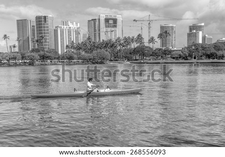 Honolulu,Hawaii,USA, April 12, 2015:  A solo outrigger canoe practices for the upcoming Hawaii State Outrigger Canoe Regatta.  Honolulu is the world center for outrigger canoe racing.
