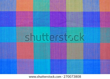 Vintage cloth backdrop with blue, orange, red, green and yellow colors.
