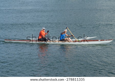 Honolulu, Hawaii, USA, May 18, 2015:  Outrigger canoe crew of  senior citizens practicing for the State of Hawaii Canoe Competition.
