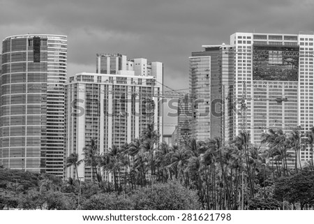 Honolulu, Hawaii, USA, May 25, 2015:  Construction cranes continue to extend the Honolulu District known as Ala Moana.  Construction is scheduled to be completed on these buildings by late 2017.