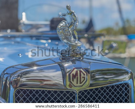 Honolulu, Hawaii, USA, June 11, 2015:  A unique automobile radiator hood ornament with a surfer riding a wave on a vintage car.