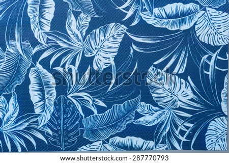 Tropical palm leaf pattern in surge blue and white colors.