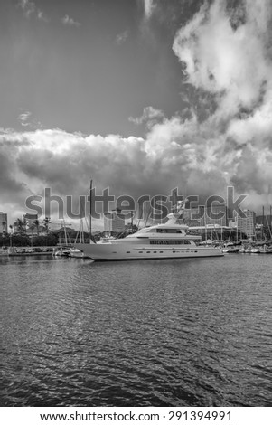 Honolulu, Hawaii, USA, June 28:  Dawn at Honolulu Hawaii\'s premier location for large yachts, the Waikiki Yacht Club, as the crew of a large power yacht prepares for a morning departure for Tahiti.