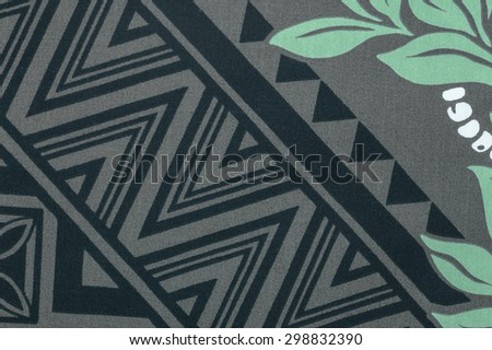 Vintage Hawaiian aloha shirt fragment in tones of black, white, gray and teal green.