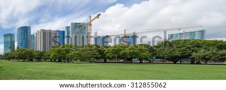 Honolulu, Hawaii, USA, Sept. 3, 2015:  Morning panorama view of Ala Moana Beach Park and the building boom occurring in the Ala Moana District of Honolulu.  New construction is booming in Hawaii.