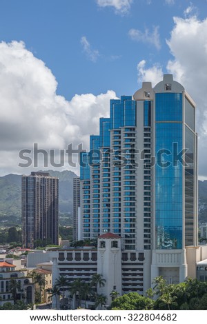 Honolulu, Hawaii, USA, Oct. 1. 2015:  Downtown Honolulu as a rising sun illuminates the gateway to Chinatown.  Honolulu is a leader in modern architectural design in the Pacific Region.