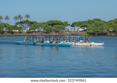 Honolulu, Hawaii, USA, Oct. 4, 2015: Morning view of two outrigger canoes on a close finish at the Hawaii State Outrigger Canoe Trials at the State of Hawaii Ala Wai Boat Harbor in Waikiki.