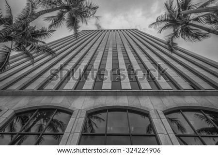 Honolulu, Hawaii, USA, Oct. 5, 2015:  Noon view of the Amfac Building in the Honolulu Financial and the energy saving reflective windows save energy on a 90 degree day.