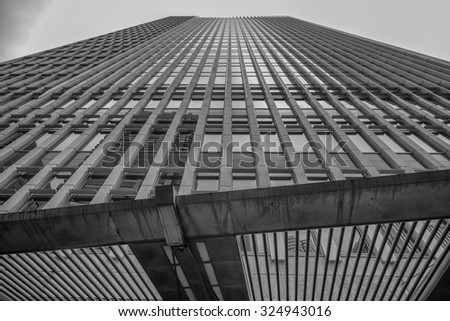 Honolulu, Hawaii, USA, Oct. 7, 2015: Vertical view at noon of sunlight reflecting off of the Finance Factors eastern exterior in the Honolulu Financial District.  Honolulu is a world financial center.