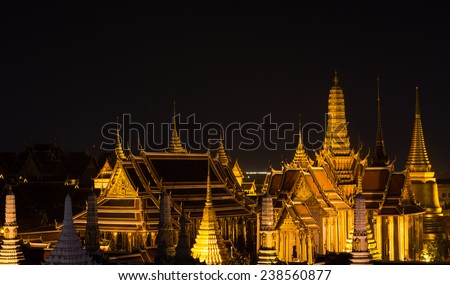 The beauty of the Emerald Buddha Temple at twilight. And while the gold of the temple catching the light. This is an important buddhist temple of thailand and a famous tourist destination.