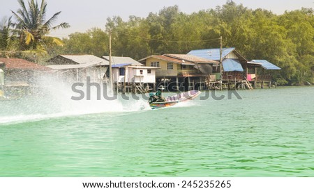 A group of tourist starting a boat ride in river . the boats are  popular means of transportation in Samut Songkhram waterways