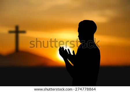 people  praying at the sunset.