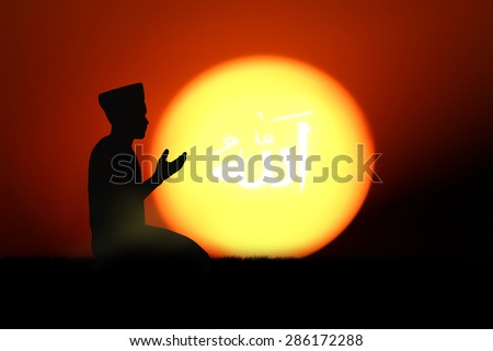 man praying to allah god of Islam on sunset.The words spell is Allah means the God of Islam.