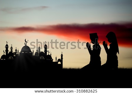 Silhouette muslim people praying at sunset,That has faith in allah God of islam supremely.