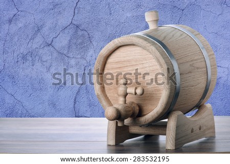 Oak barrel on blue concrete background