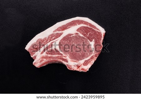 Similar – Foto Bild Rohes Schweinesteak auf einem Teller, Ansicht von oben. Steak isoliert auf blauem Hintergrund