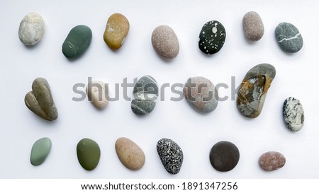 Similar – Image, Stock Photo Various pebbles on black sandy shore in sunlight