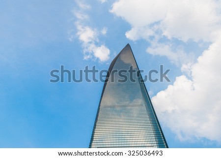 SHANGHAI-FEB. 24, 2015: World Financial Center against blue sky. SWFC opened on 28 August 2008. The second tall and landmark of Shanghai China. Nearby Jinmao tower.