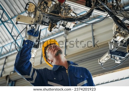 Similar – Image, Stock Photo Male technician programming machine in garage