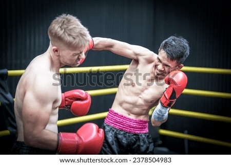 Similar – Foto Bild Kickbox-Kämpfer-Training in einem Fitnessstudio mit Boxsack.