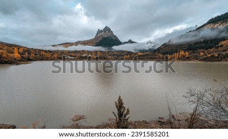 Similar – Image, Stock Photo Cloud drama and lakeside with reflection in moor lake