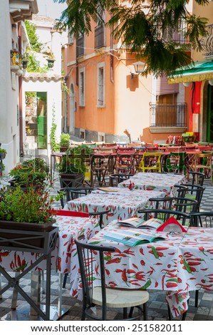 Tables of a Restaurant/pizzeria in the main square of Castelmola, a small touristic village near Taormina