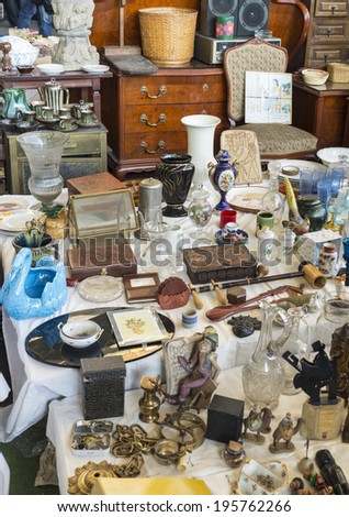 Barcelona, Spain - March 12, 2014: Objects used, furniture, artwork and ornaments on a market stall in the most famous flea market in Barcelona, also known Els Encants Vells.
