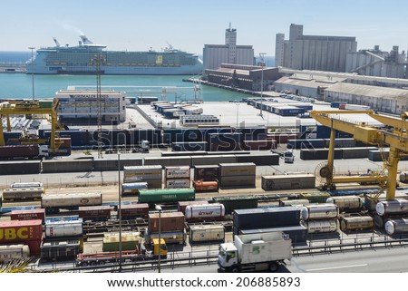 Barcelona, Spain - May 14, 2014: Overview where there are all kinds of containers, tanks, new cars and tied the Liberty of the Seas cruise