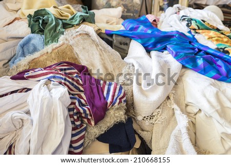 A heap of clothes for sale in the most famous flea market in Barcelona, also known as Els Encants or Els Encants Vells, located in Glories neighborhood.