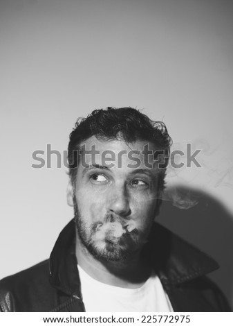Sexy man face with sunglasses smoking a cigarette, grunge art style, black and white