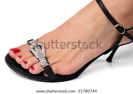 Female foot in fashion sandals with diamond belt