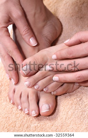 Pedicured feet and manicured hands