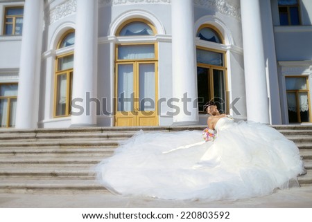 Beautiful bride lying on the stairs