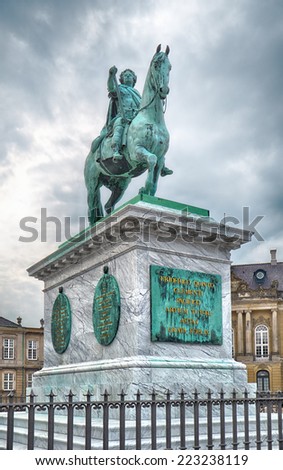 COPENHAGEN, DENMARK - AUGUST 22, 2014:  Equestrian bronze statue of King Frederik V in Amalienborg Square in Copenhagen, Denmark. The statue was created by the French sculptor Jacques Saly in 1768.