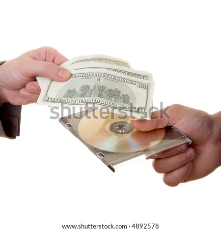 Man\'s hand with dollars and CD isolated at the white background