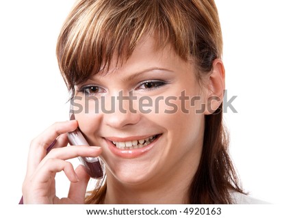 Young smiling girl speaking on the telephone isolated at the white background