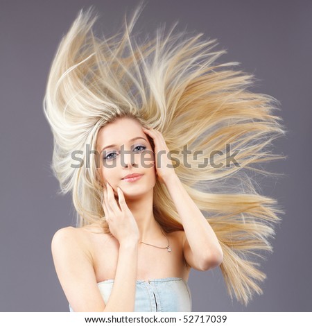 portrait of beautiful slavonic blonde girl with fluttering hair