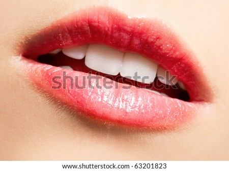 close-up portrait of beautiful girl's lips-zone make-up