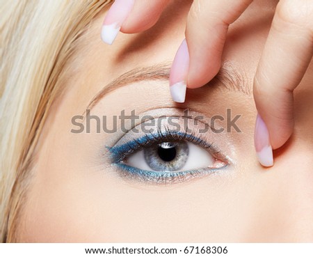 close-up portrait of beautiful girl's eye-zone make-up