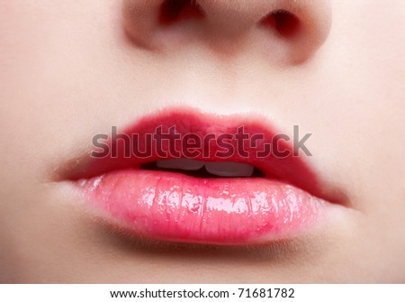 close-up portrait of beautiful girl\'s lips zone make-up