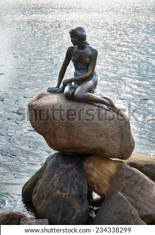 COPENHAGEN, DENMARK - AUGUST 22, 2014: Little Mermaid statue. The monument of Little Mermaid is one of the biggest tourist attractions in Copenhagen and Denmark