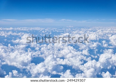 View on cumulus clouds from the plain